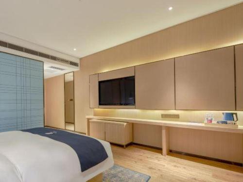 Katil atau katil-katil dalam bilik di Echarm Hotel Liuzhou High-speed Railway Station