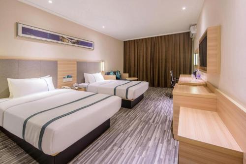 Postel nebo postele na pokoji v ubytování City Comfort Inn Nanning Railway East Station Langdong Bus Station