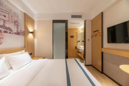 Letto o letti in una camera di City Comfort Inn Jinan West Station Shandong International Convention and Exhibition
