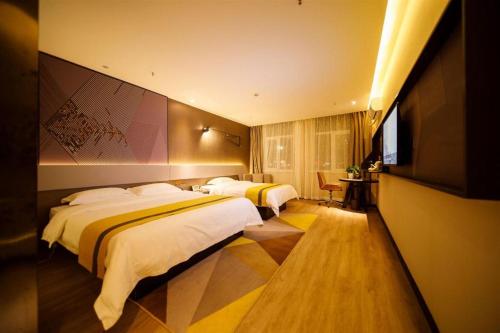 Postel nebo postele na pokoji v ubytování IU Hotels· Xincheng Haibing University Store