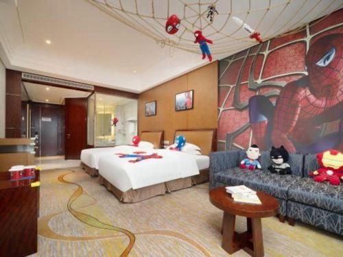 a hotel room with a bed and a couch at Balan International Hotel in Dujiangyan