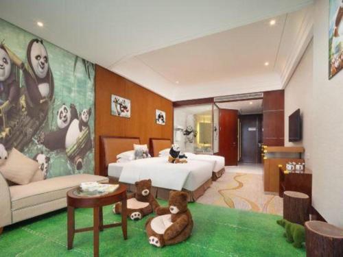 a bedroom with a bed and a living room at Balan International Hotel in Dujiangyan