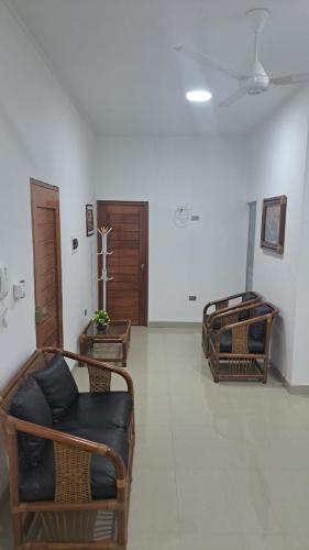 a living room with two beds and a couch at Departamento amoblado in Iquitos