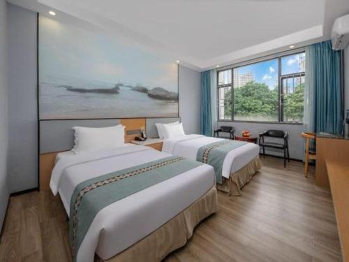 Katil atau katil-katil dalam bilik di Zhenxing Hotel