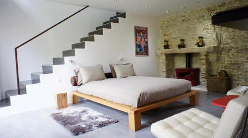 Ένα ή περισσότερα κρεβάτια σε δωμάτιο στο La Demeure de Saint Fiacre