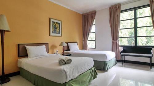Postel nebo postele na pokoji v ubytování Casa D' Ladera Hotel