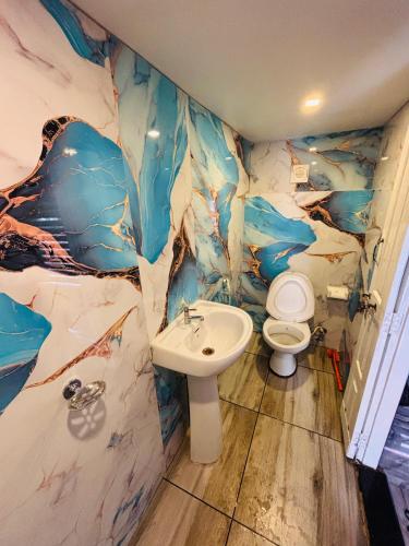 a bathroom with a toilet and a sink at Sreekrishna houseboat Alappuzha in Alleppey