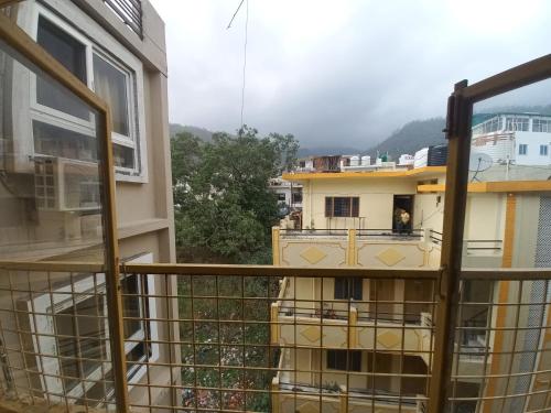 a view from the balcony of a building at Devi music ashram in Rishīkesh