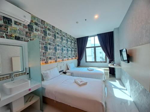 Ein Bett oder Betten in einem Zimmer der Unterkunft SELECTA HOTEL Medan