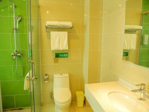 a bathroom with a toilet and a sink and a shower at GreenTree Inn Qinhuangdao Changli County Guangyuan Life Square Duanyang Street East Section in Qinhuangdao