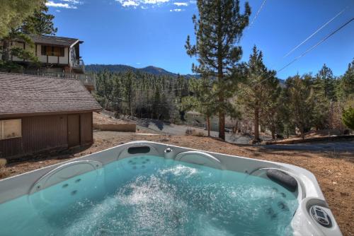 a hot tub in the backyard of a house at Yosemite Pines Cabin - Sleeps 6 in Big Bear Lake