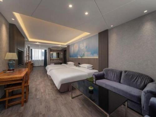 Un ou plusieurs lits dans un hébergement de l'établissement Xi'an Huiya Tianmu Hotel
