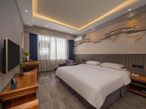 Un ou plusieurs lits dans un hébergement de l'établissement Xi'an Huiya Tianmu Hotel