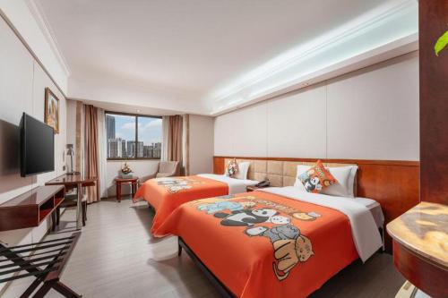Giường trong phòng chung tại Guangzhou Navy Hua Hai Hotel