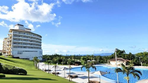 a view of a resort with a swimming pool at ANA Crowne Plaza Resort Okinawa Uruma Hills By IHG in Uruma