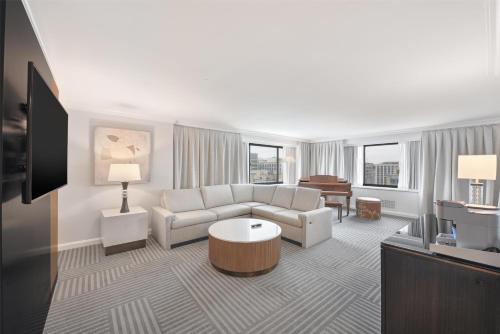 a living room with a couch and a table at Capital Hilton in Washington