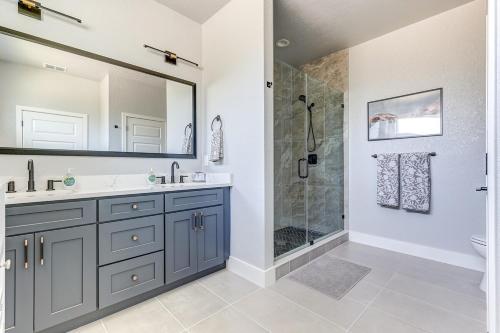 a bathroom with a sink and a shower at Chic & Spacious 4 Bedroom 3 Full Bathrooms Retreat in West Tampa and Pvt Backyard in Tampa