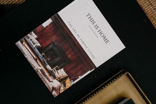 a book with a picture of a house at Empire Spa Retreat in Dunsborough