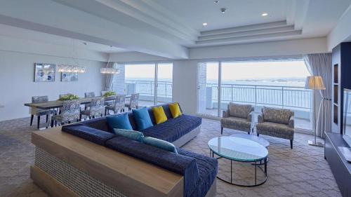 a living room with a couch and a table at Hotel Harvest Nankitanabe in Tanabe