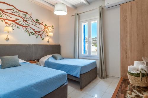 Ένα ή περισσότερα κρεβάτια σε δωμάτιο στο Porto Galini Tinos Volax 101