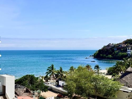 a view of the ocean from a building at Luxury Oceanview 2BR La Cruz de Huanacaxtle in Cruz de Huanacaxtle