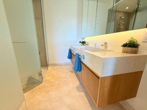 a bathroom with a sink and a mirror at Luxury Oceanview 2BR La Cruz de Huanacaxtle in Cruz de Huanacaxtle