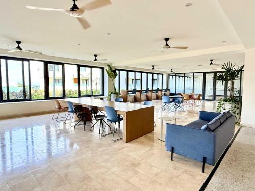a large living room with a large table and chairs at Luxury Oceanview 2BR La Cruz de Huanacaxtle in Cruz de Huanacaxtle