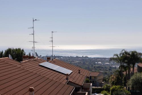 a roof of a house with a solar panel on it at Little Rose garden in Aci Catena