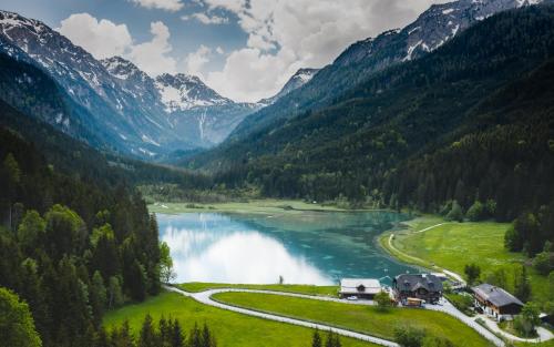 a view of a river with mountains in the background at Landhaus Riepler in Wagrain