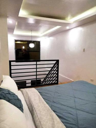 a bedroom with a bed and a television in it at Orchid Bed and Breakfast in Galicias