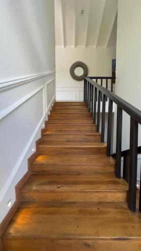 a staircase in a house with wooden floors at Benito Bungalow, Haputale by The Serendipity Collection in Haputale