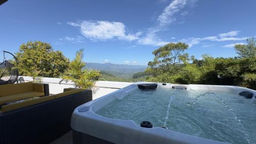 a hot tub on the back of a house at Benito Bungalow, Haputale by The Serendipity Collection in Haputale