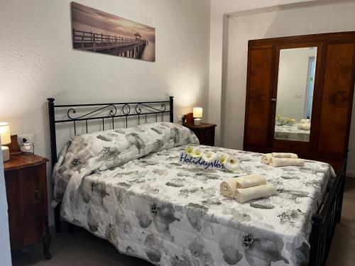 Ένα ή περισσότερα κρεβάτια σε δωμάτιο στο Casa Giorgia by Holiday World