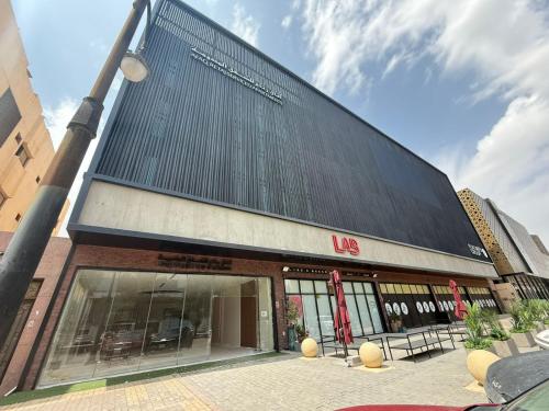 a building with a lot of windows and a street light at Afaq Retaj Serviced Apartments in Riyadh