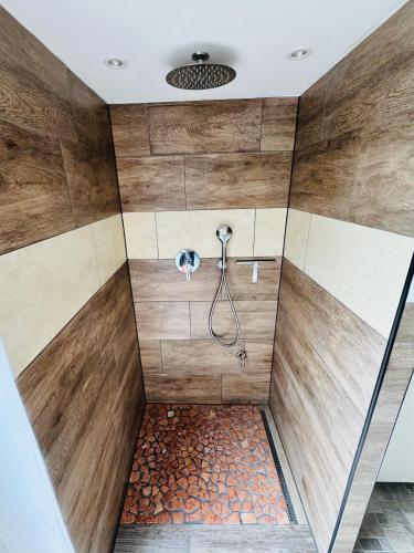 a bathroom with a shower with a hose at Apartment Hearzzeit in Herzberg am Harz