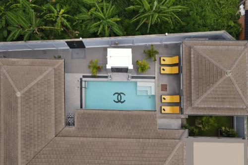 an overhead view of a house with a swimming pool at 3BR Villa Marine with Private Pool, Waterfalls in NaiHarn Beach in Rawai Beach