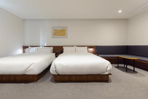 Katil atau katil-katil dalam bilik di Moor Hotel Mokpo By Aank