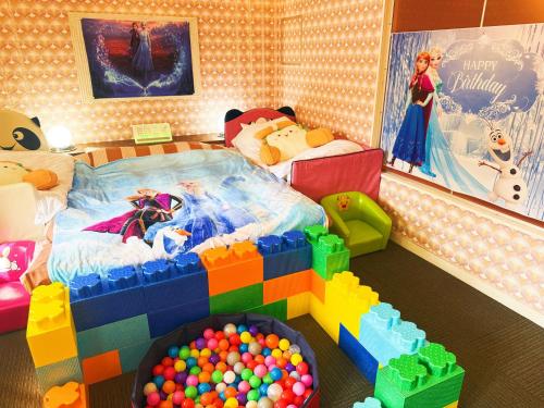 a childs bedroom with a lego bed and a pool of balls at Ikaho no mori Kids Paradise in Ikaho