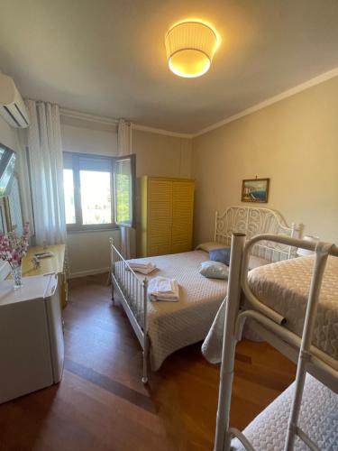 a bedroom with two bunk beds and a window at La Terrazza Quisisana Sorrento Coast in Castellammare di Stabia