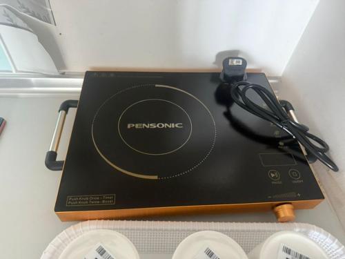 a black box sitting on top of a refrigerator at Meritus Suites - 8pax in Perai