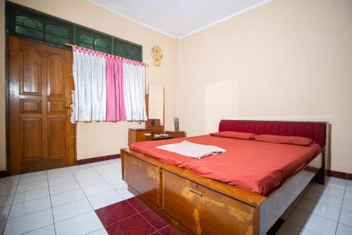 Postel nebo postele na pokoji v ubytování Homestay Uti Maguwoharjo