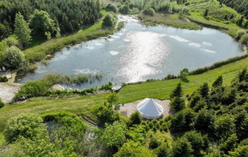 an aerial view of a lake with a tent at Lovely Home In Nibe With Lake View in Nibe