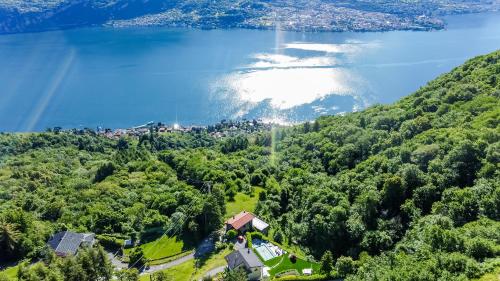 an aerial view of a lake and a house at Campeggio Internazionale Madonna del Ghisallo in Magreglio