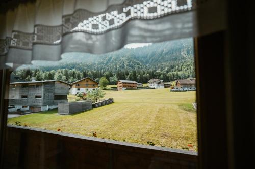 a window with a view of a field of grass at Haus Margreth in Mellau