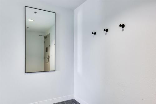a mirror on a wall next to a white wall at Homewood Suites by Hilton Louisville-East in Louisville