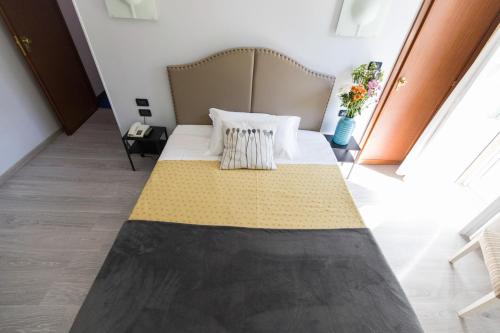 Un ou plusieurs lits dans un hébergement de l'établissement Hotel Ponte Sassi