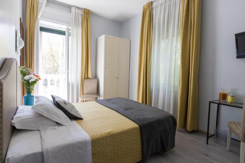 Postel nebo postele na pokoji v ubytování Hotel Ponte Sassi