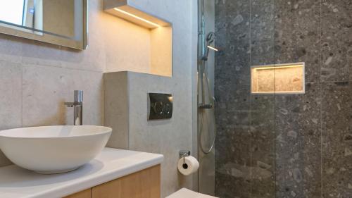 a bathroom with a bowl sink and a shower at Alpesa Apartments in Budva