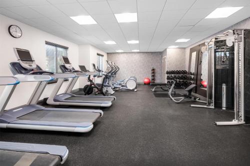 a gym with treadmills and elliptical machines at Homewood Suites By Hilton San Jose Santa Clara in San Jose