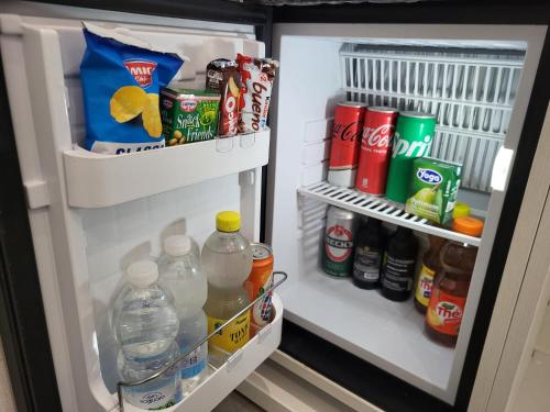 an open refrigerator filled with drinks and drinks at Hotel Porto Di Roma in Civitavecchia